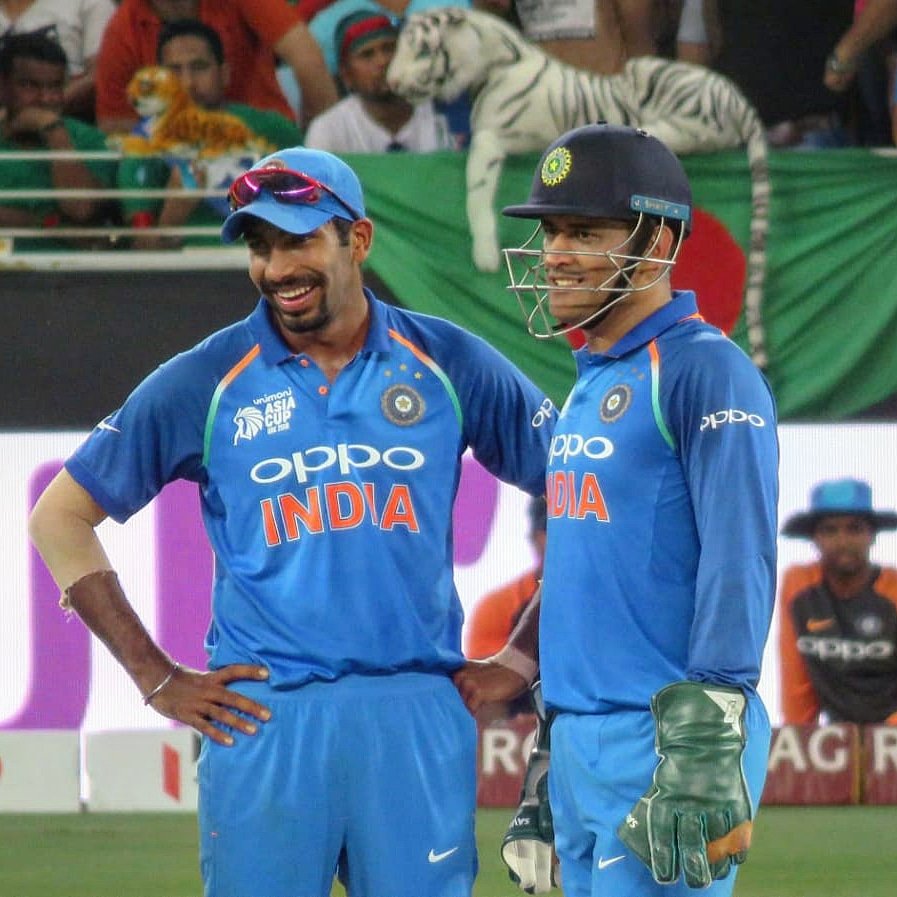 MS Dhoni (R) with Jasprit Bumrah 