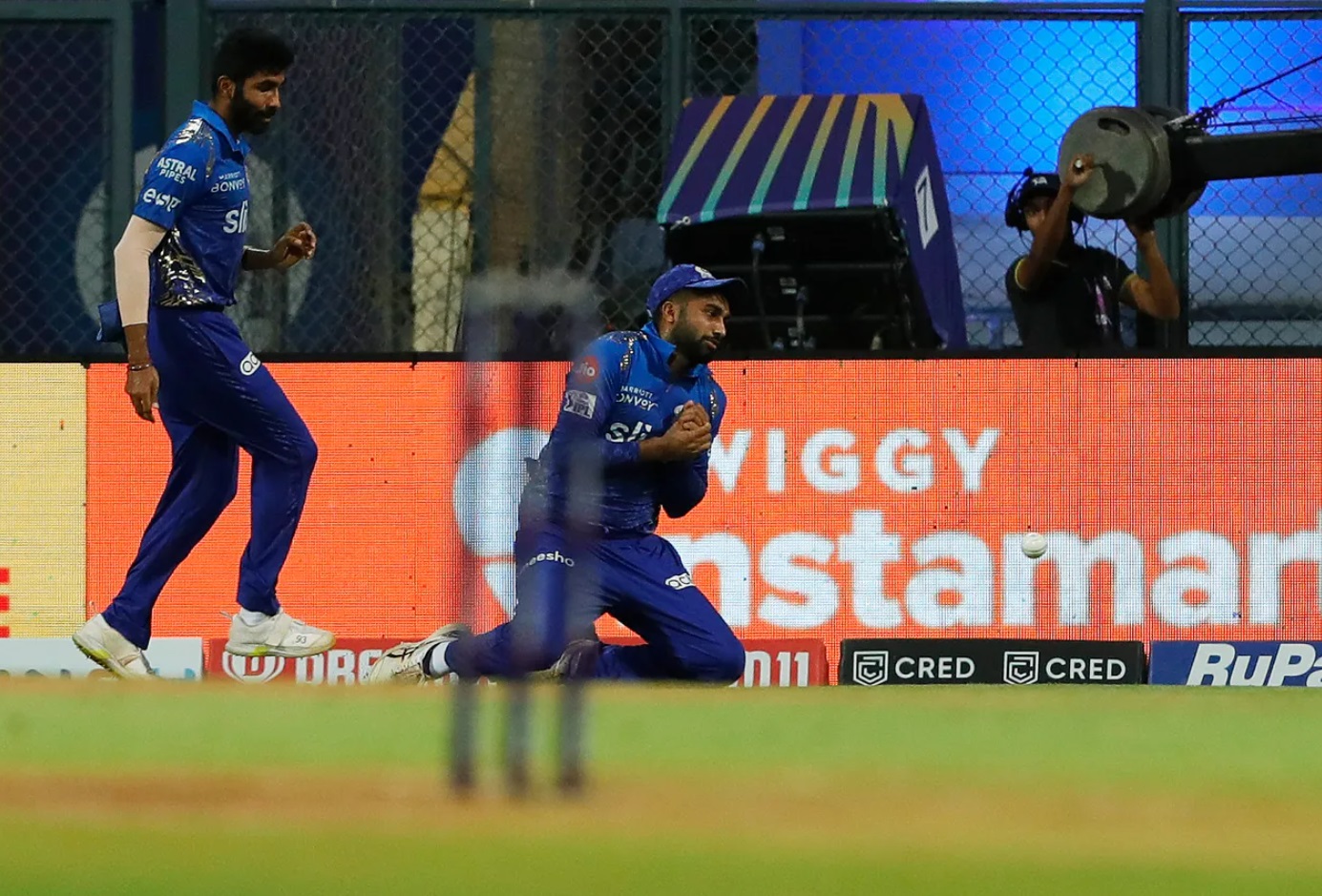 Miscommunication between Jasprit Bumrah and Sanjay Yadav leads to drop catch.