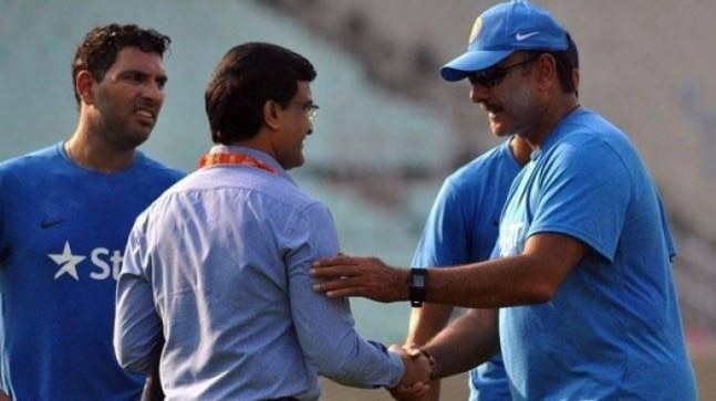 BCCI president Sourav Ganguly (L) shaking hands with Ravi Shastri 