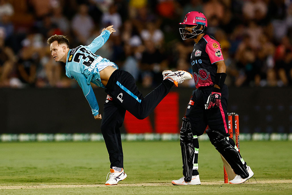 Matthew Kuhnemann and Babar Azam in action during the Sydney Sixers vs Brisbane Heat match in BBL 2025-26 in Coffs Harbour.